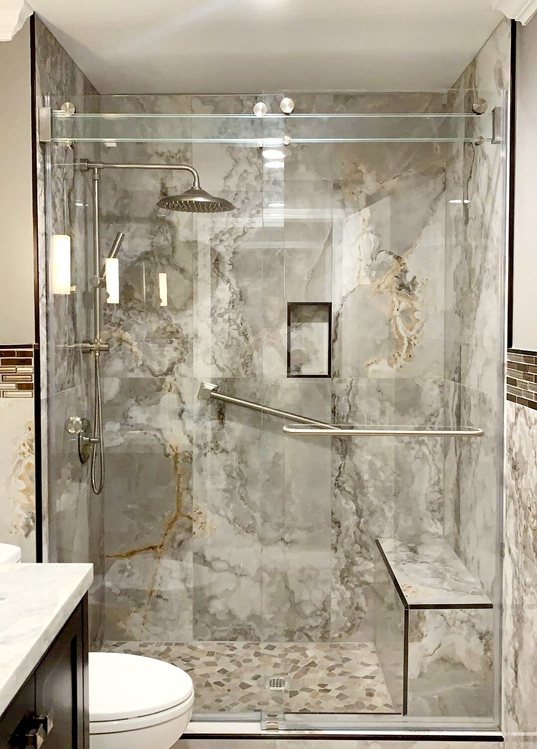 Phantom slider from 310 Tempering. The glass bar across the top is triple laminated for safety! All glass is low iron to ensure the clearest, most seamless sliding shower.