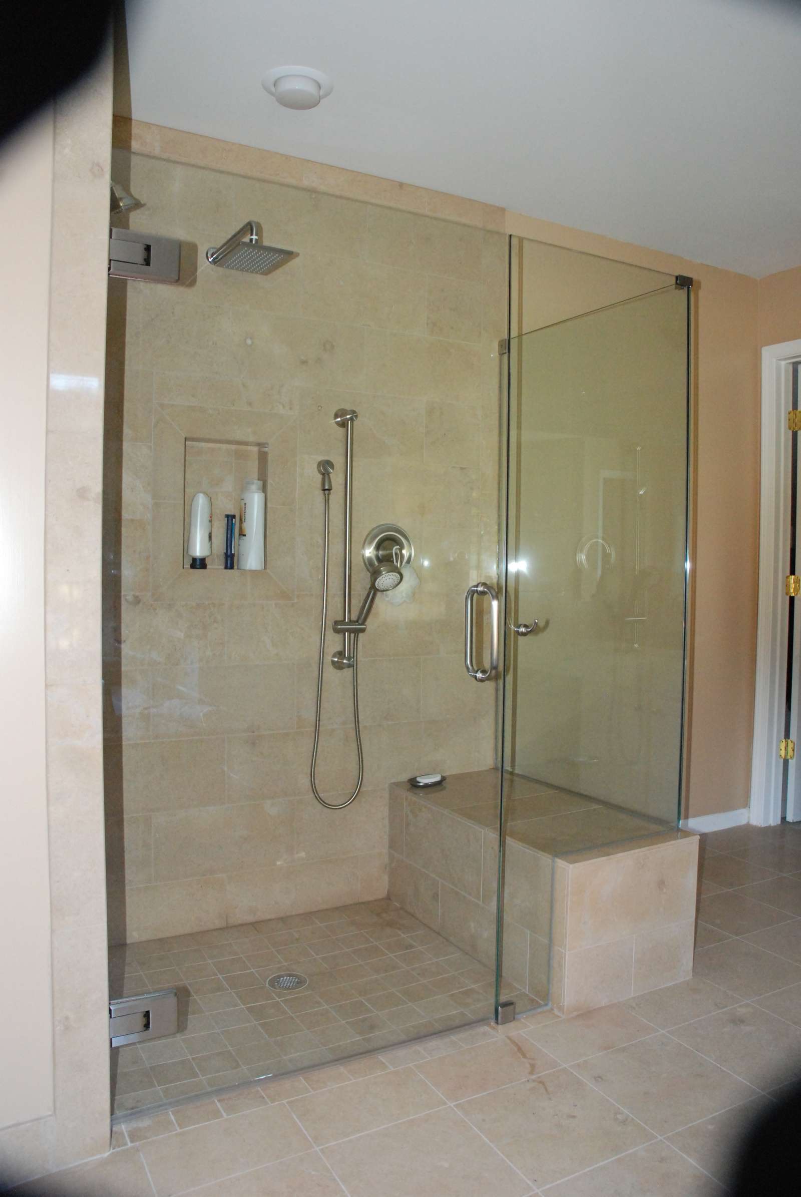 This is a handicap shower enclosure for full wheelchair access using hydraulic Atlas hinges. This hinge accommodates up to 39" wide opening with adjustable closing speeds and positions.