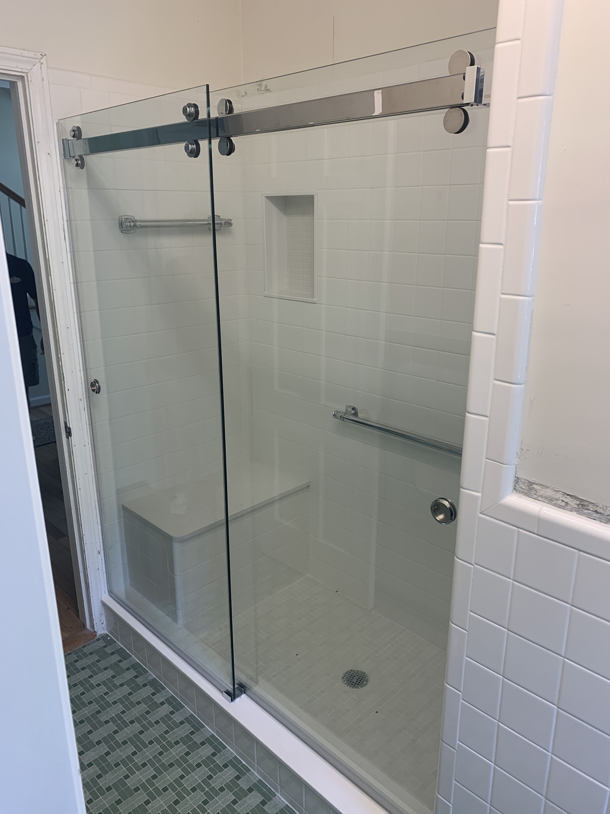 A Cambridge style slider from CR Laurence is a barn style slider and allows both doors to slide. The handles can be customized to your needs, however, the knobs on this shower are called "finger cups" which allow the doors to bypass. 